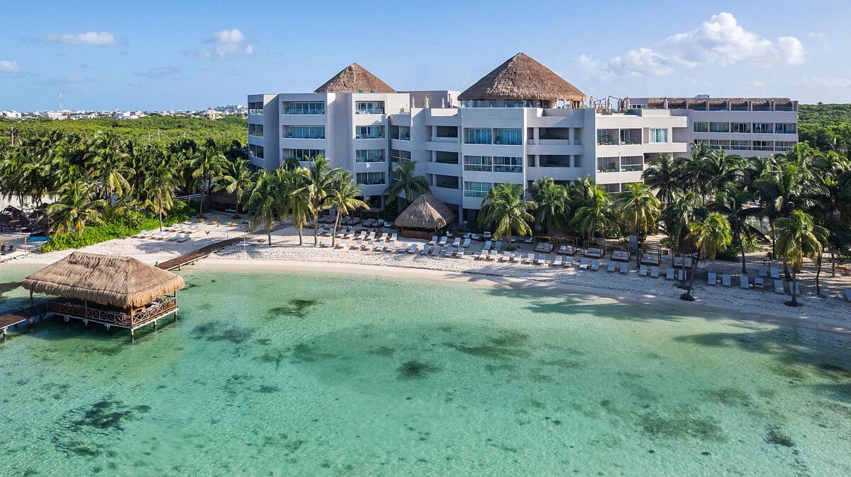 Almare Luxury Collection Resort Isla Mujeres boutique beachfront hotel with upscale design and ocean views.
