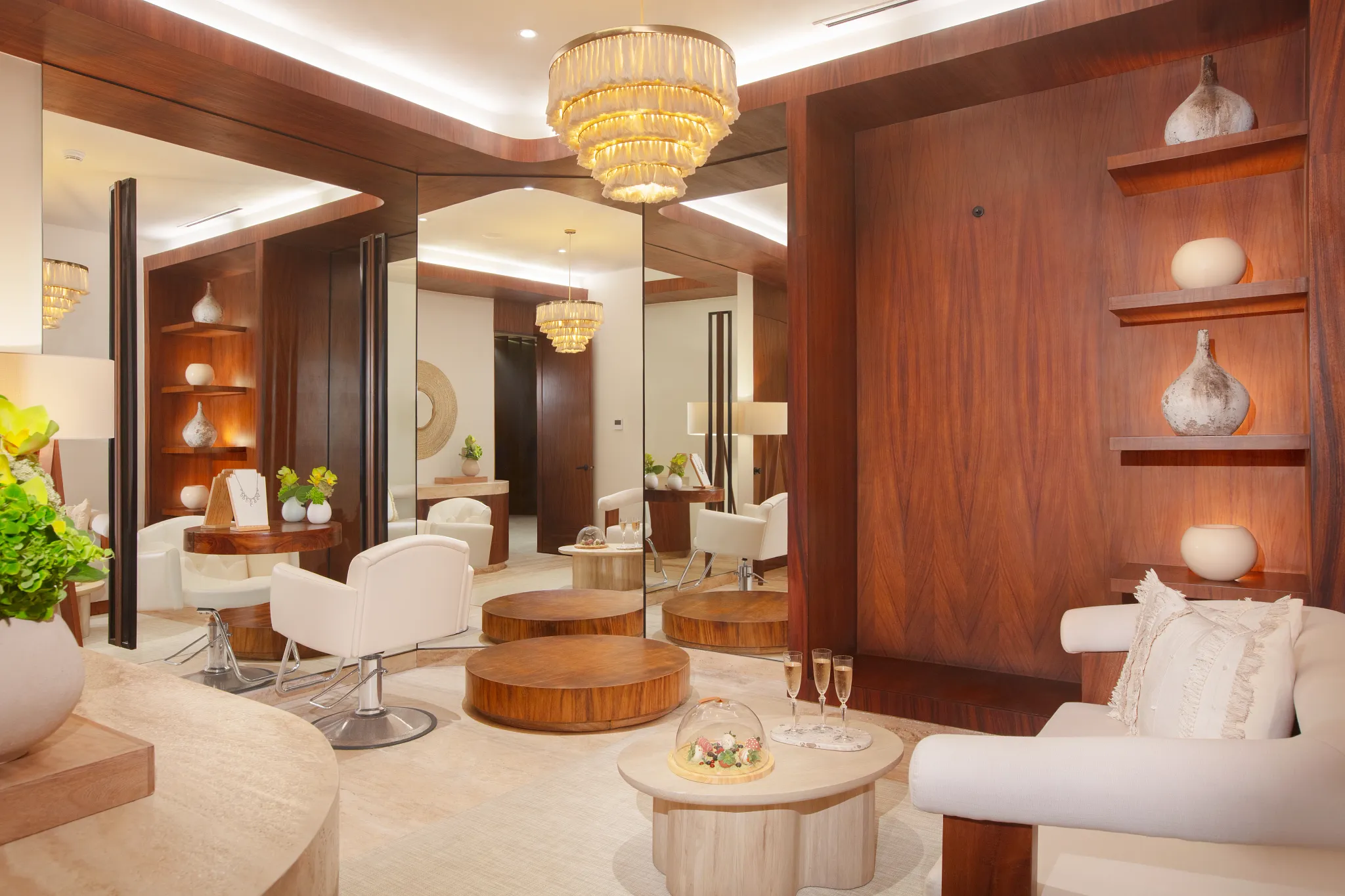 Elegant bridal spa suite with seating area and chandelier at Impression Isla Mujeres by Secrets.