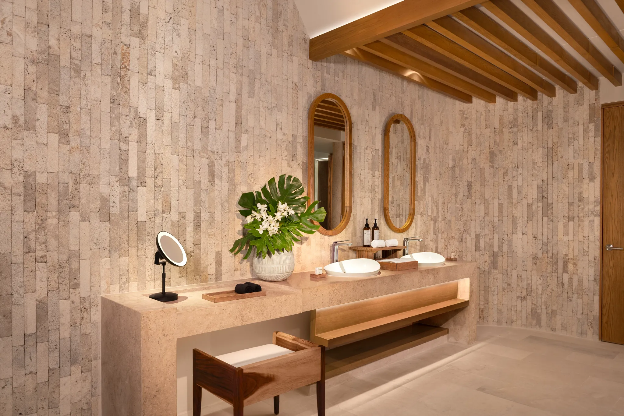 Spacious bathroom with double vanity and modern finishes in Honeymoon Ocean View suite at Impression Isla Mujeres by Secrets.