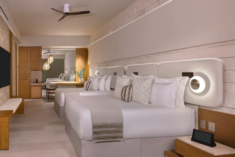 Junior Suite Double Ocean View with two queen beds and modern décor at Impression Isla Mujeres by Secrets.