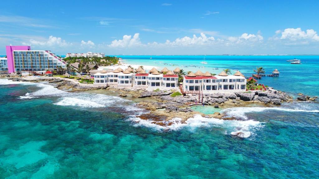 Mia Reef Isla Mujeres all-inclusive resort on a private island with white sand beaches and turquoise water.
