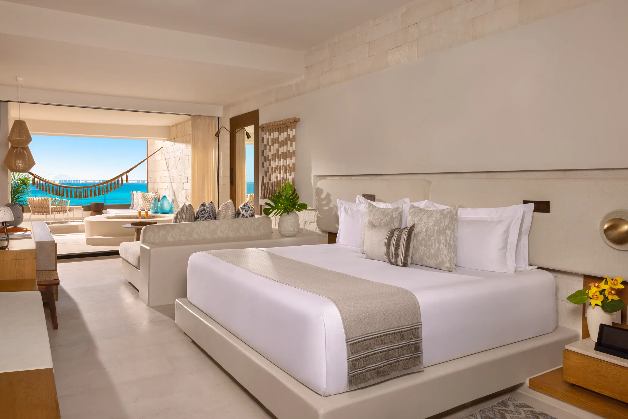 Paramount Suite Ocean Front bedroom with king bed and ocean view at Impression Isla Mujeres by Secrets.