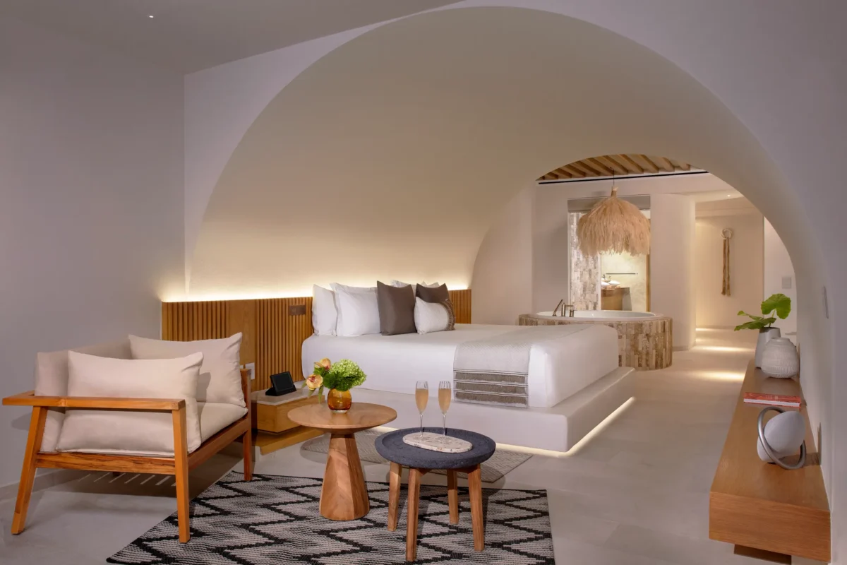 Presidential Suite bedroom with king bed and modern decor at Impression Isla Mujeres by Secrets.