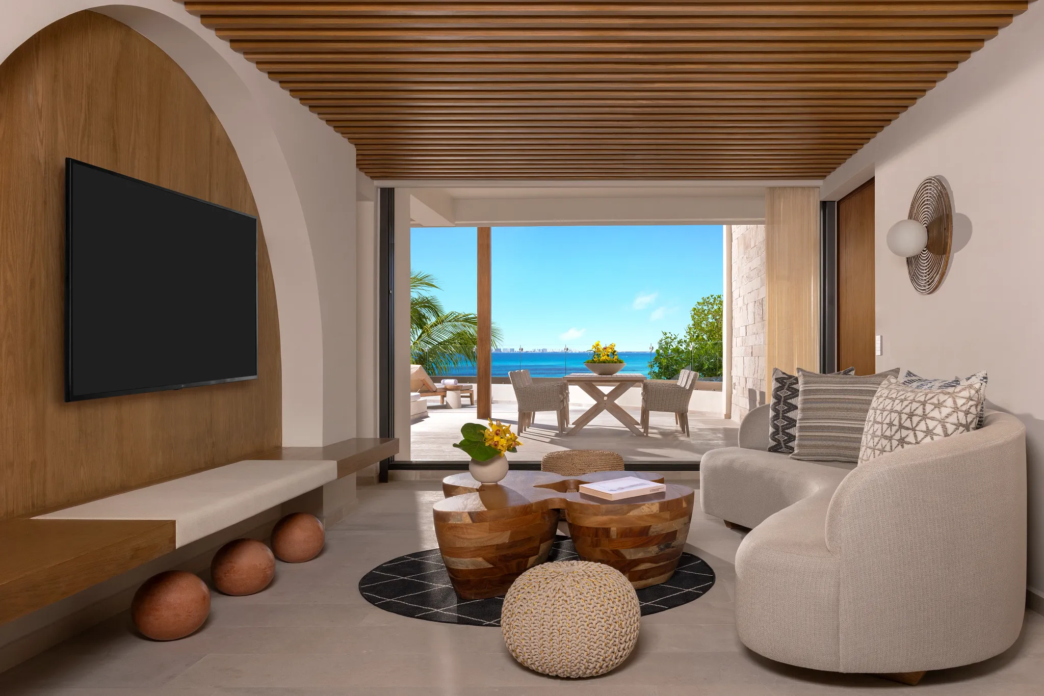 Living room with ocean view and terrace access in Presidential Suite at Impression Isla Mujeres by Secrets.