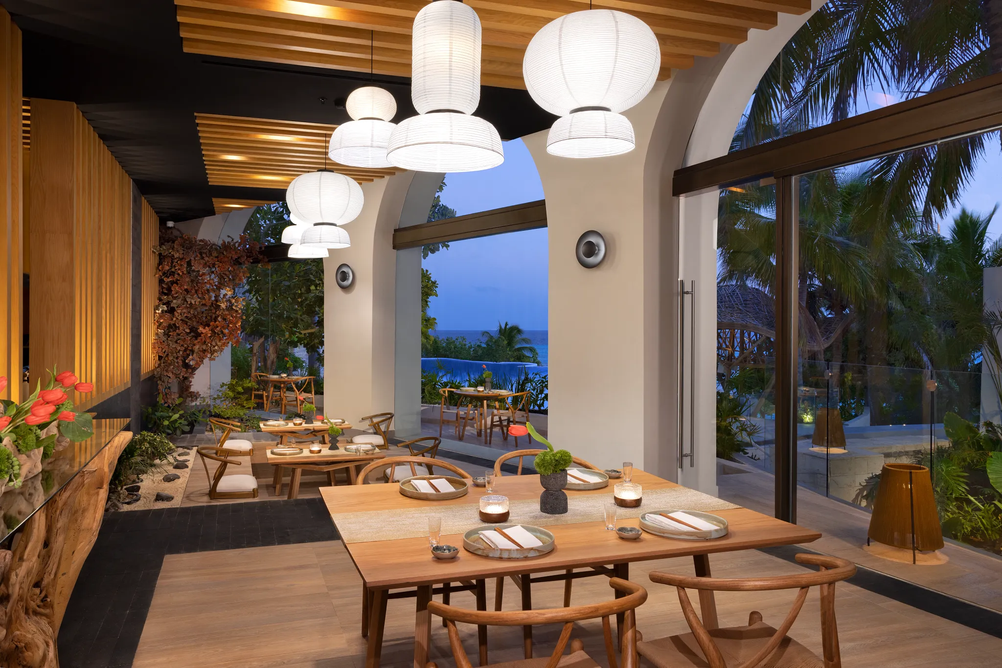 Sake restaurant at Impression Isla Mujeres by Secrets featuring a modern Asian-inspired dining space with sushi bar and elegant design.