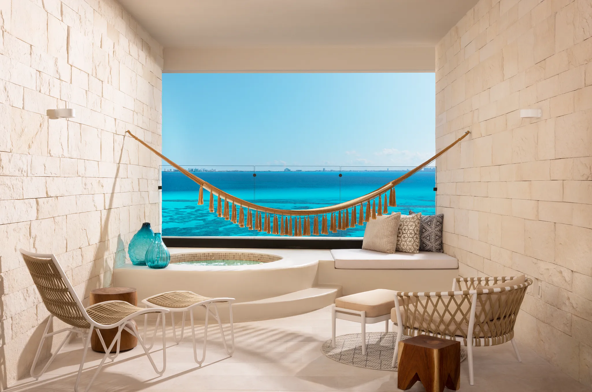 Oceanfront terrace with Mayan tub and hammock in Signature Junior Suite Double Ocean Front at Impression Isla Mujeres by Secrets.