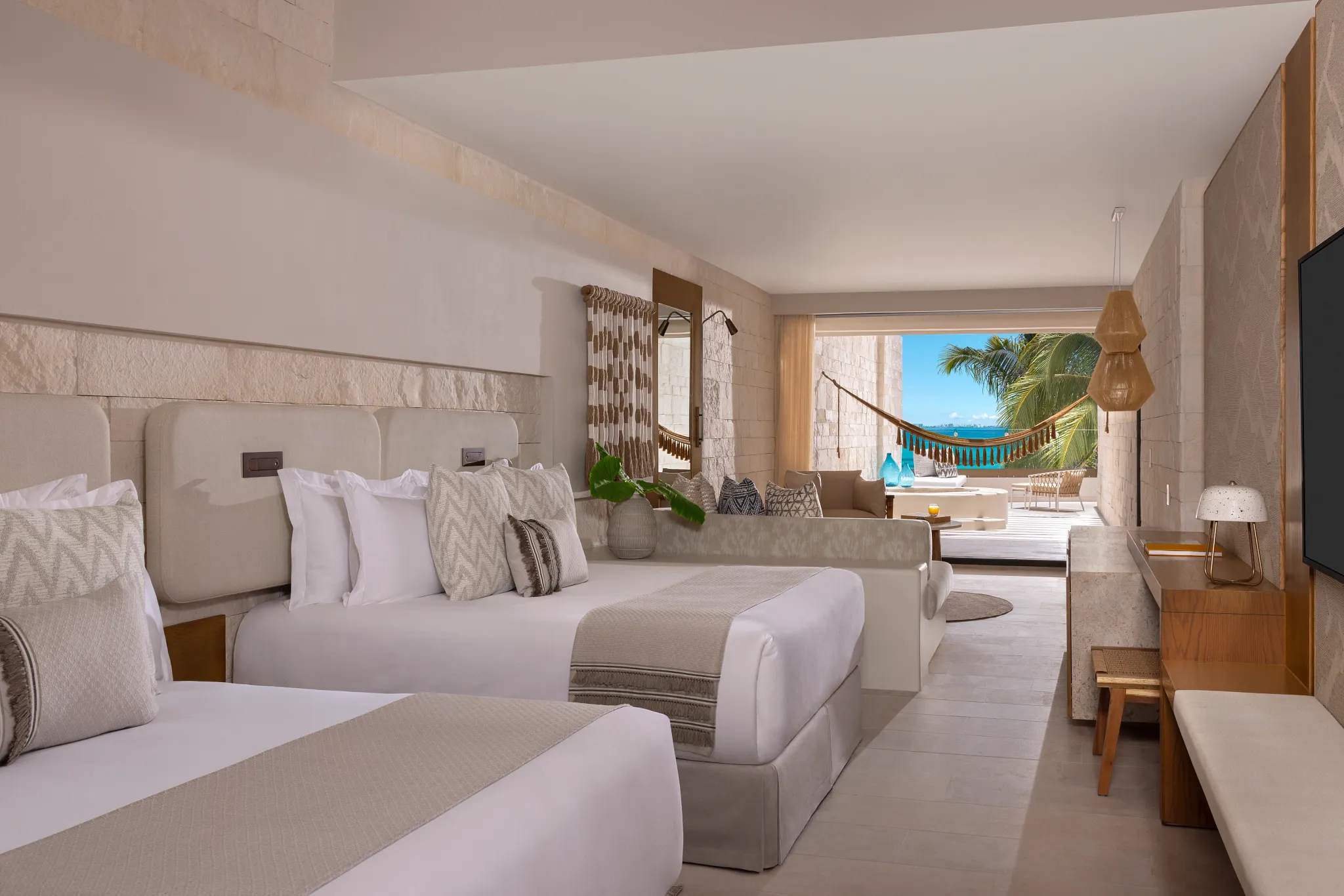 Signature Junior Suite Double Ocean View with two queen beds and Mayan tub at Impression Isla Mujeres by Secrets.