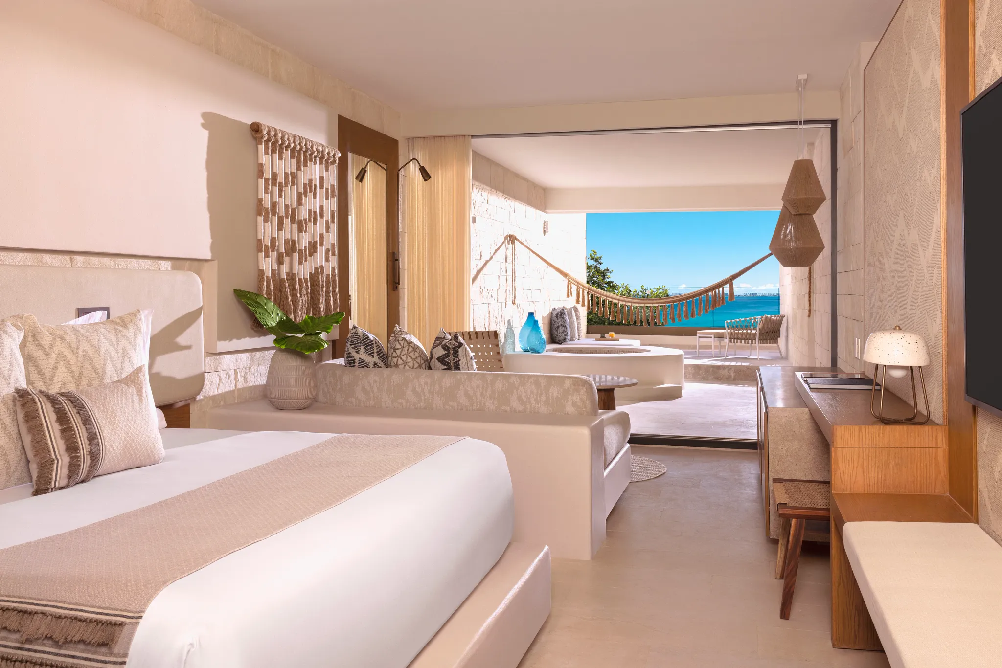 Signature Junior Suite King Ocean View with Mayan tub and king bed at Impression Isla Mujeres by Secrets.