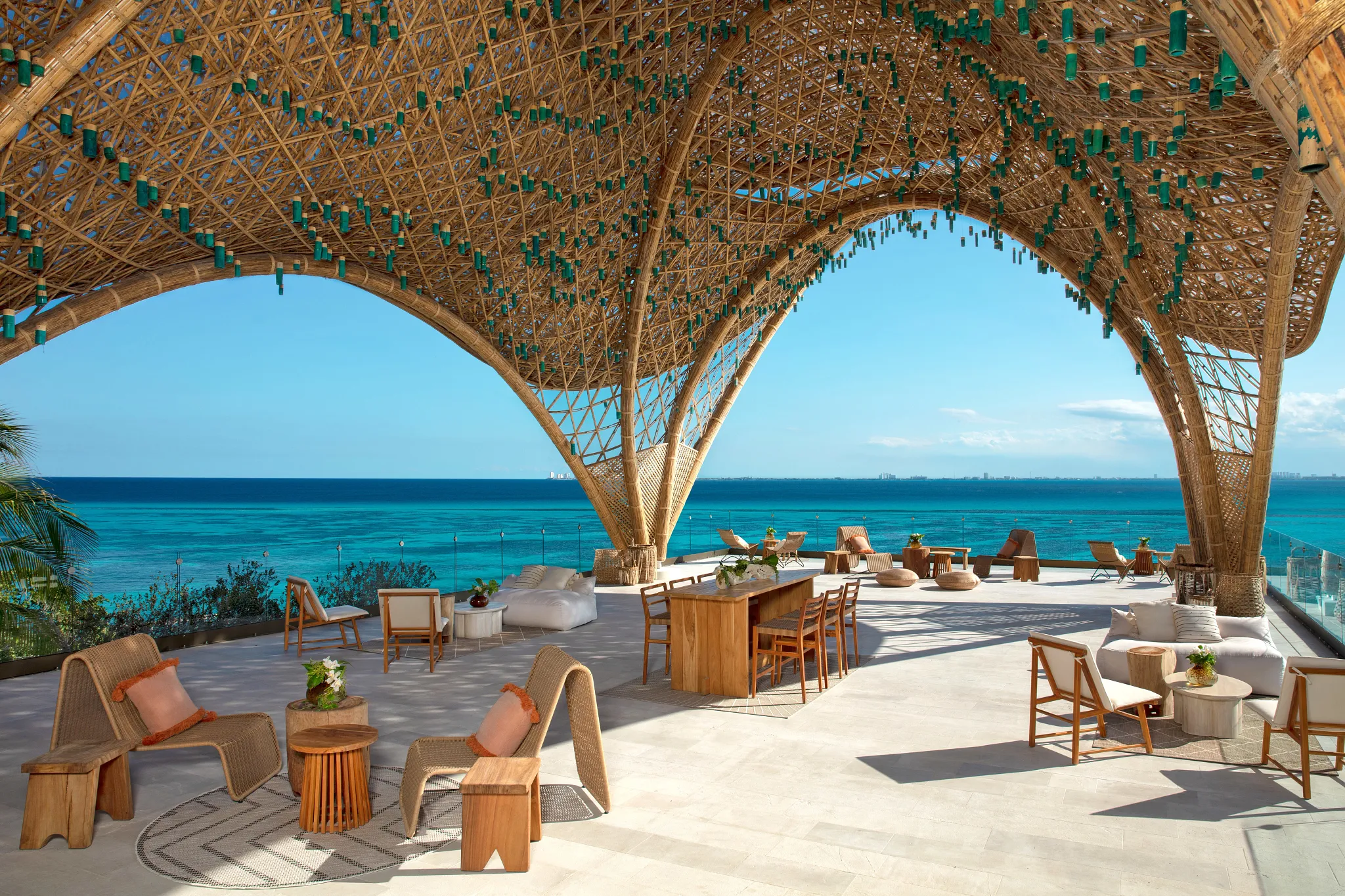 The Temple at Impression Isla Mujeres by Secrets featuring a serene open-air dining setting, modern design, and tranquil oceanfront ambiance.