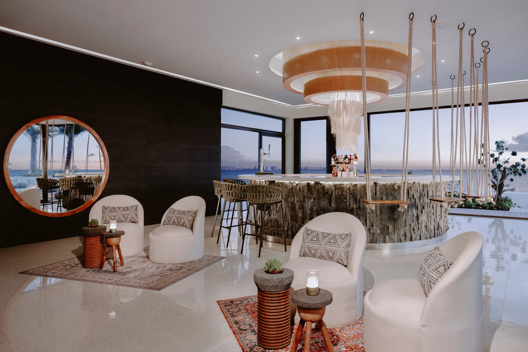 The Top rooftop at Impression Isla Mujeres by Secrets featuring an elevated infinity pool, panoramic ocean views, and stylish lounge seating.